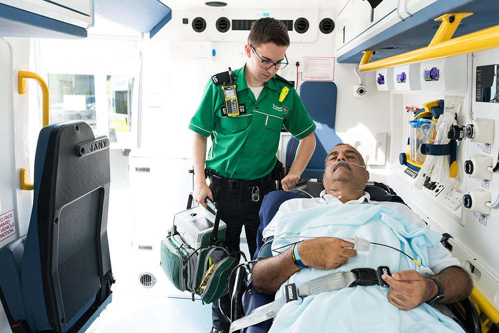 St John Ambulance crew member looking after patient