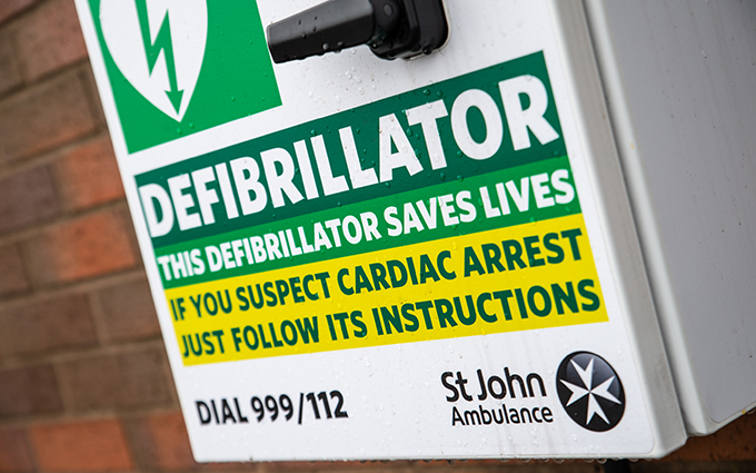 St John Ambulance defibrillator cabinet on a wall