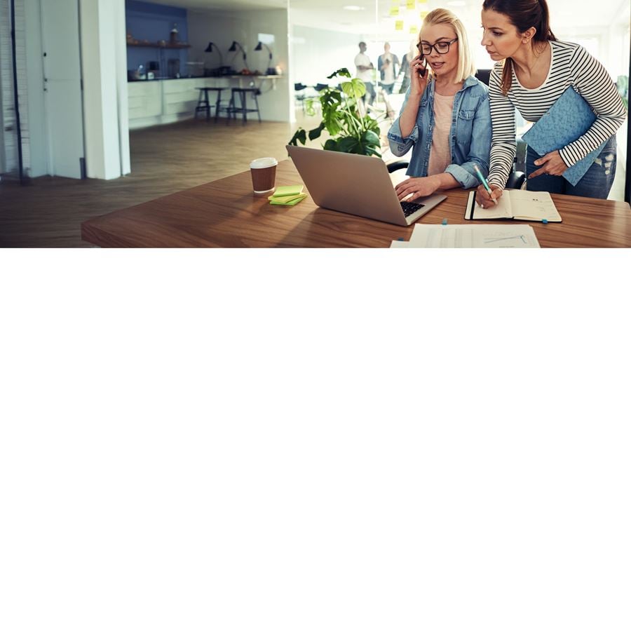 Two people discussing a task at work.